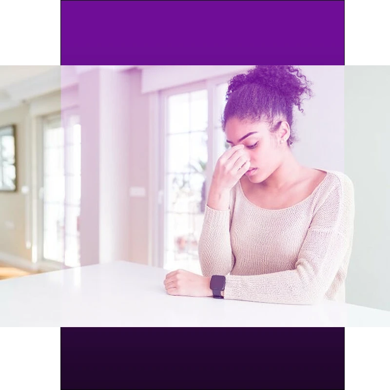 Woman holding nose in discomfort