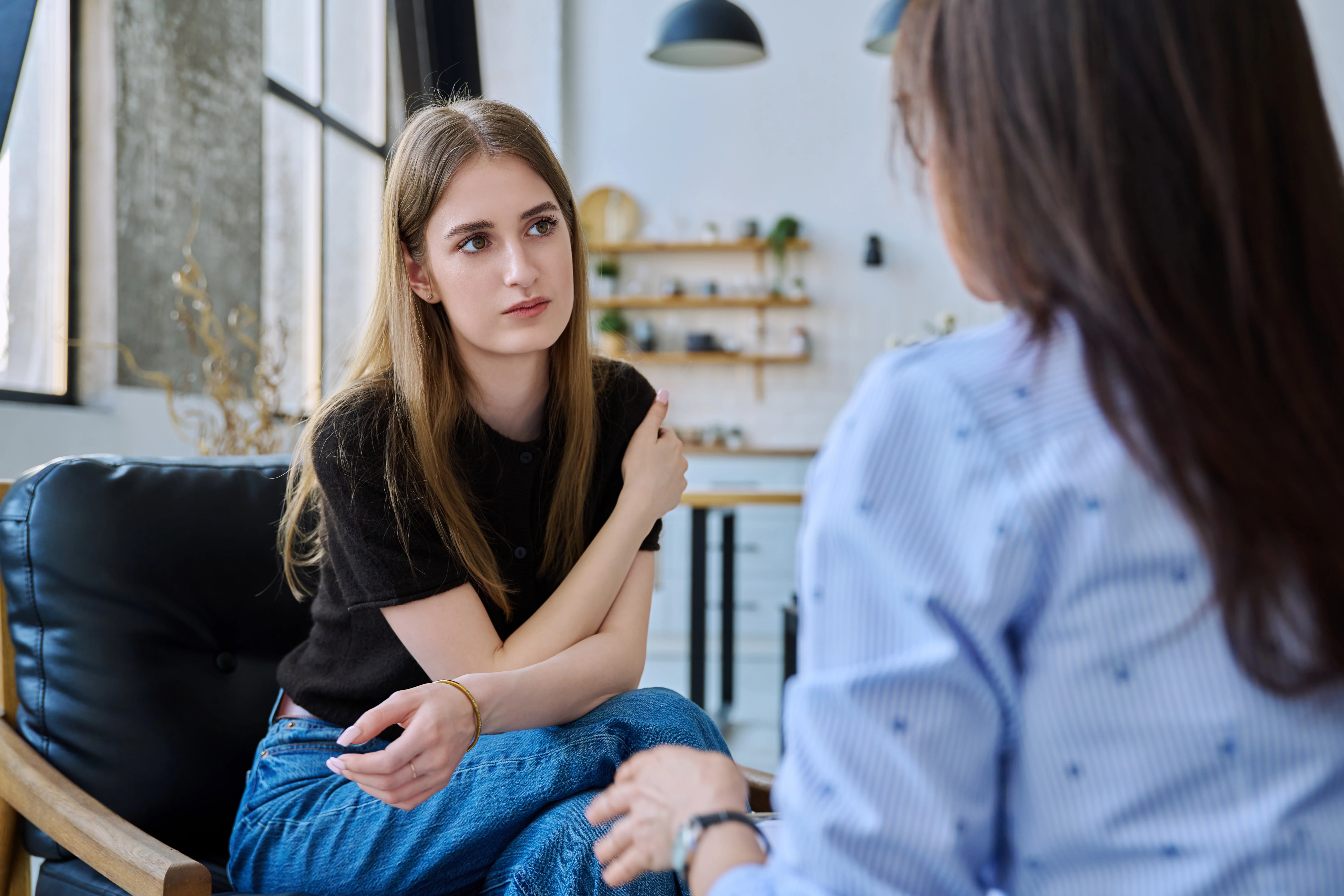 Two women having a conversation.