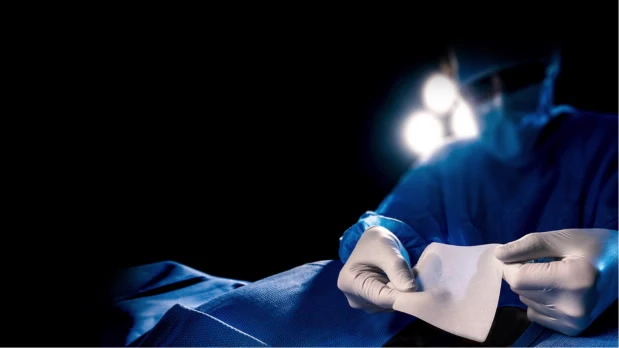 Doctor with collagen matrix - black background