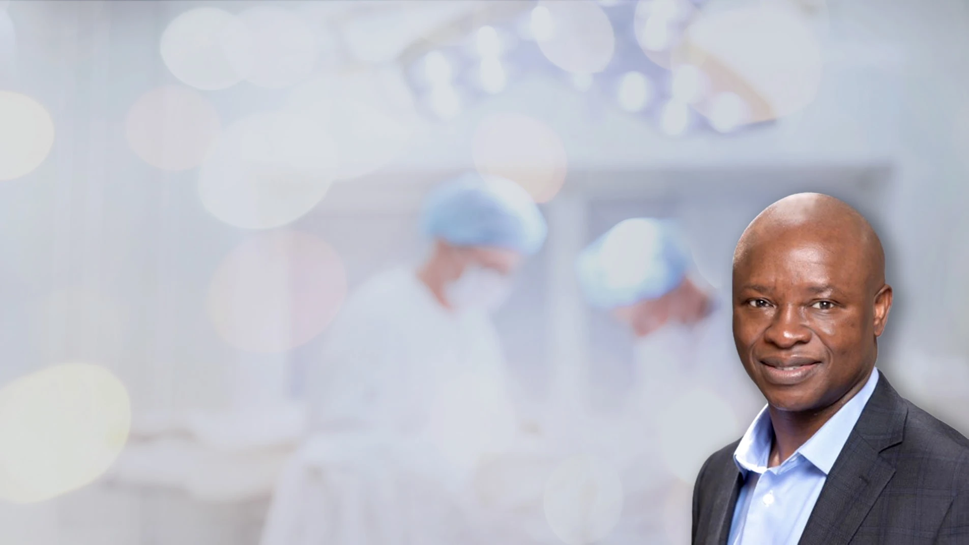 Man with doctors in the background