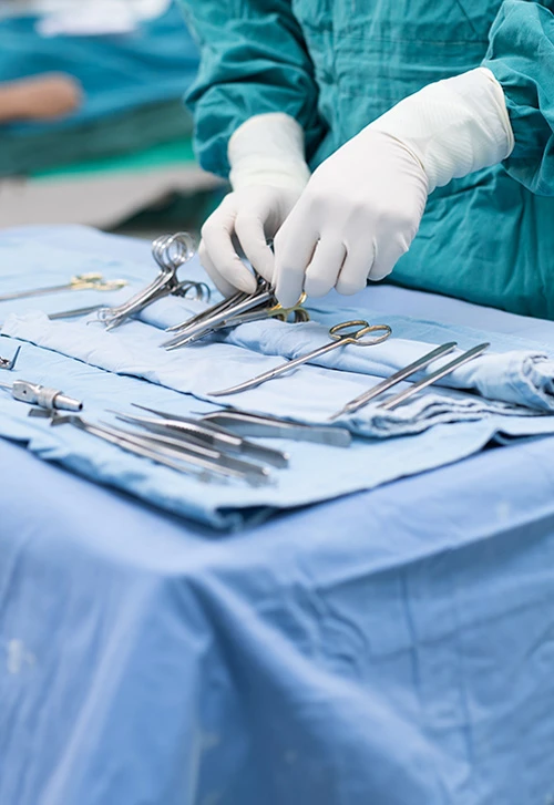 Medical professional organizing medical tools on a tray